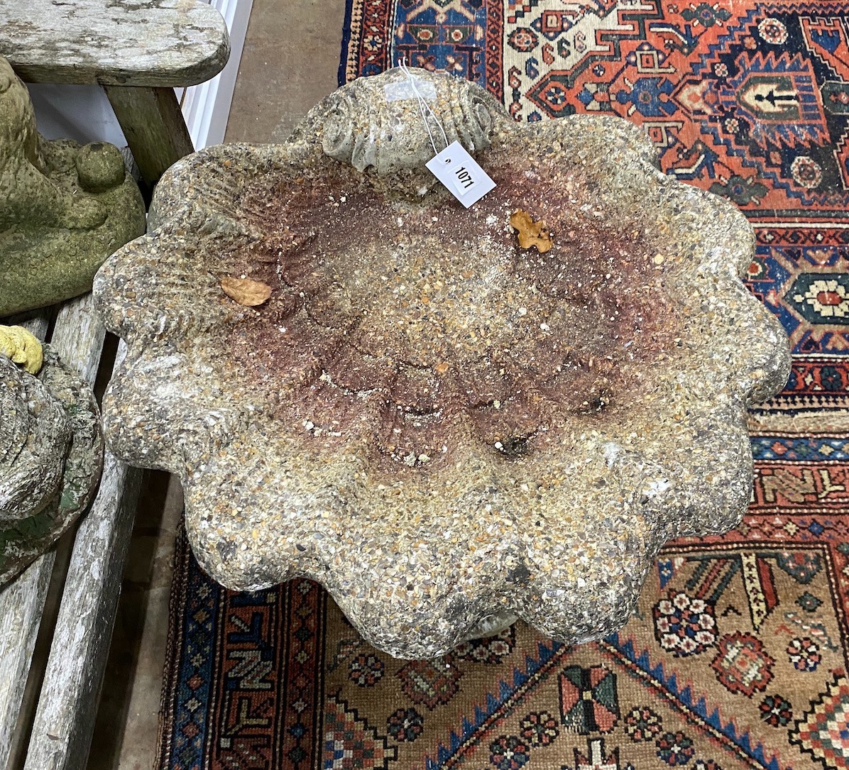 A reconstituted stone bird bath, width 55cm height 69cm